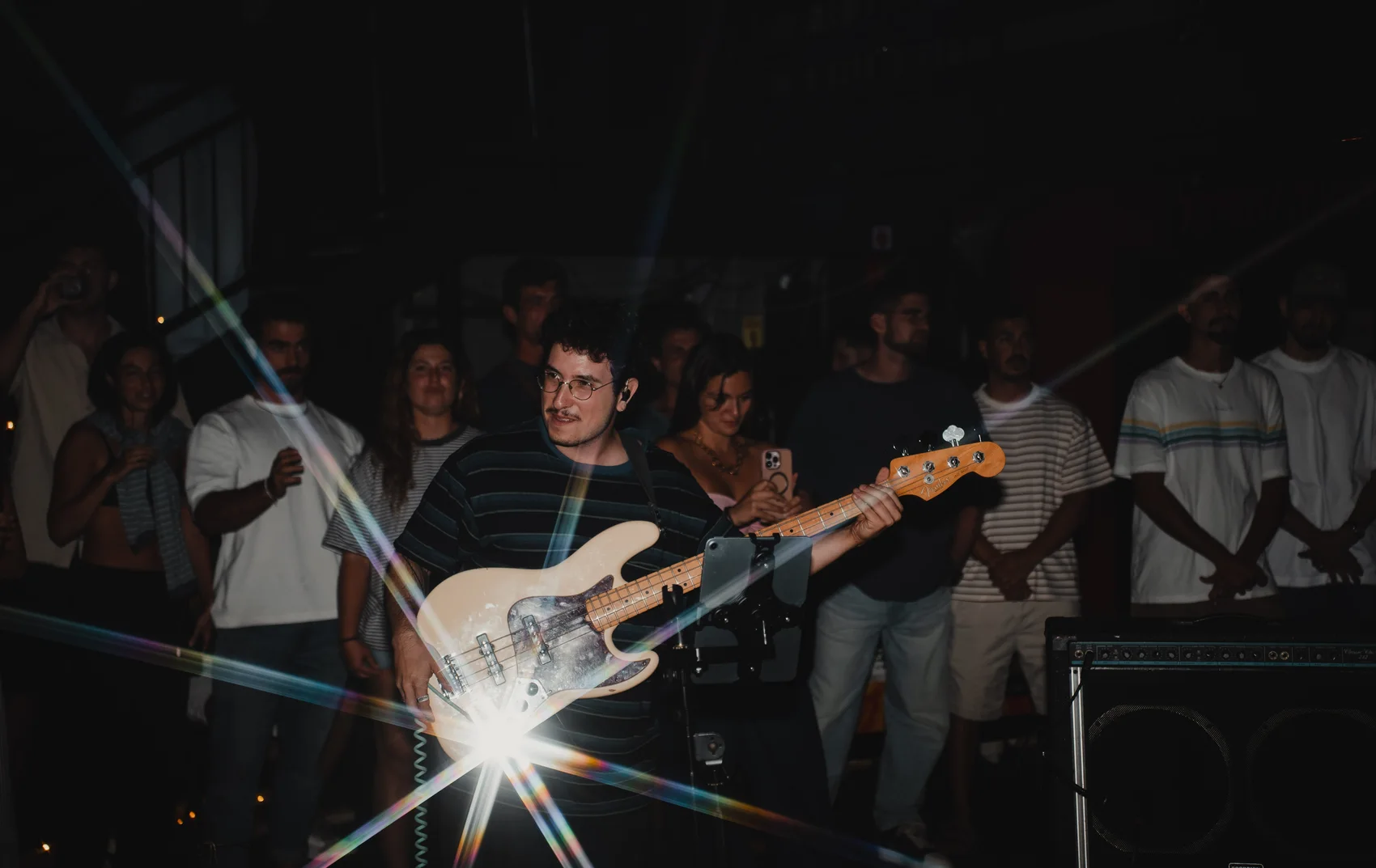 Hod Segev playing guitar among the audience
