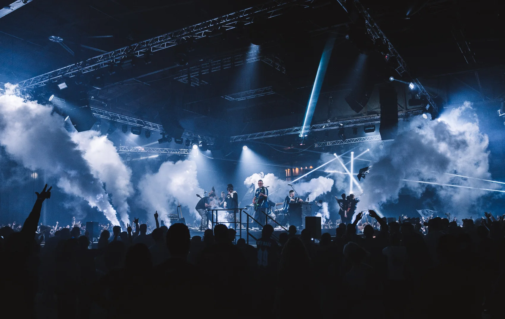 Peled on a smoke-filled stage above a packed crowd