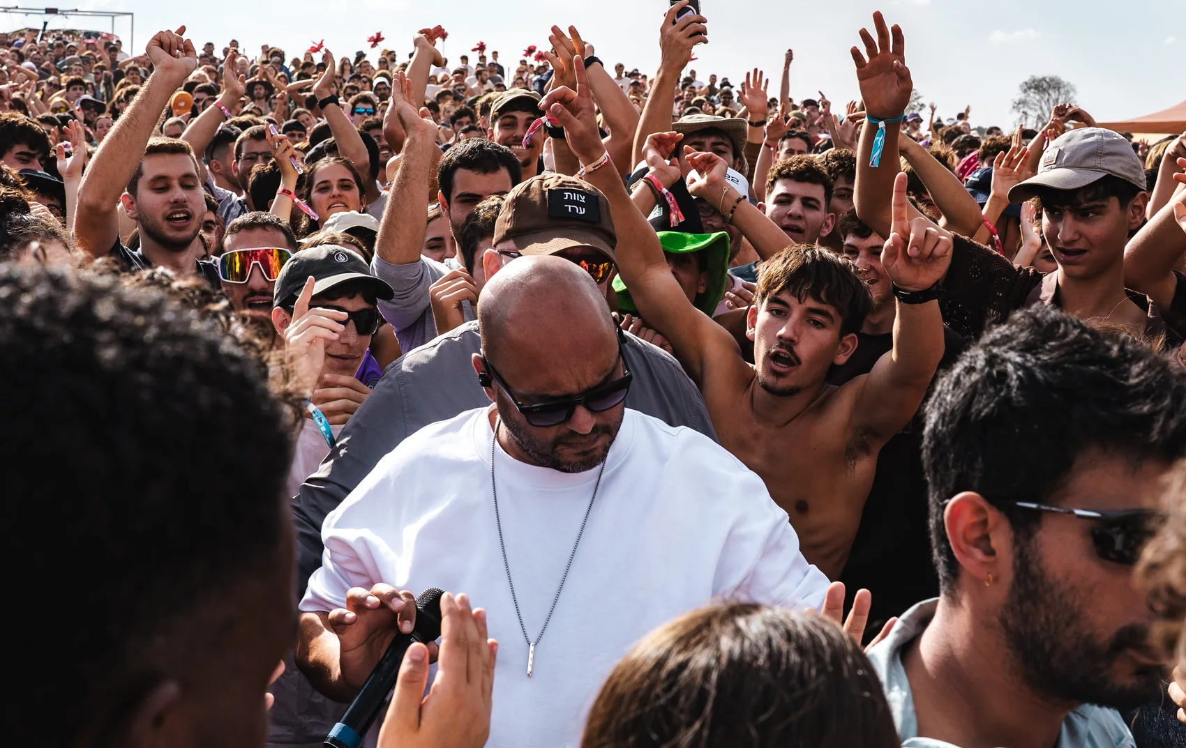 Shai Tsabari moving through a festival crowd