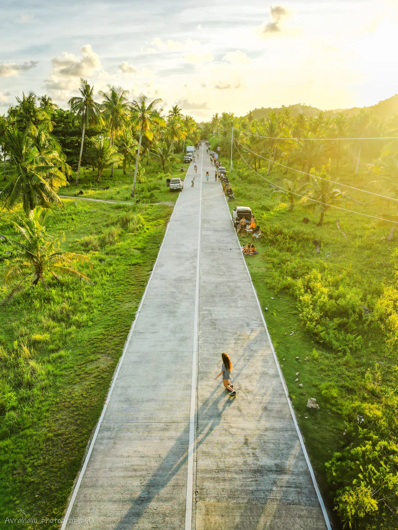 A person walking a narrow island trail seen from above